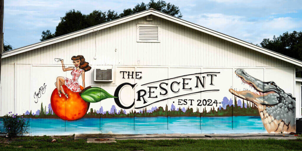 MuckRock Mural side of building with alligator and girl_The Crescent Coffee_Crescent City_Brandy Jo Hastings_ MuckRock Mural side of building with alligator and girl_The Crescent Coffee_Crescent City_Brandy Jo Hastings