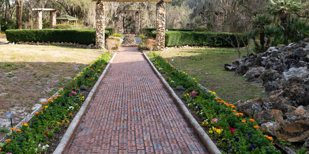 Ravine Gardens State Park_walkway lined with flowers leading to arch_Palatka_Putnam County_Brandy Jo Hastings (1 of 1) Ravine Gardens State Park_walkway lined with flowers leading to arch_Palatka_Putnam County_Brandy Jo Hastings